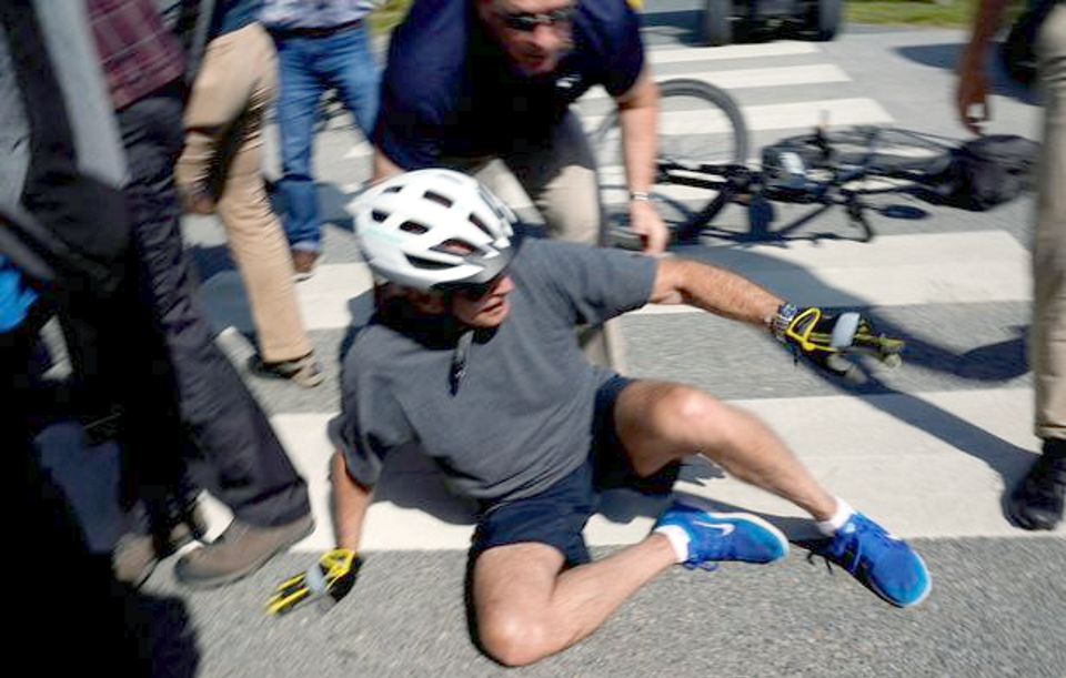 Biden falls off bike.