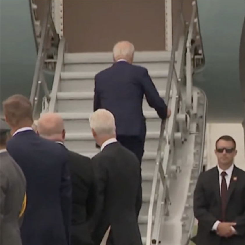 Biden stumbles a bit as he boards Air Force One.