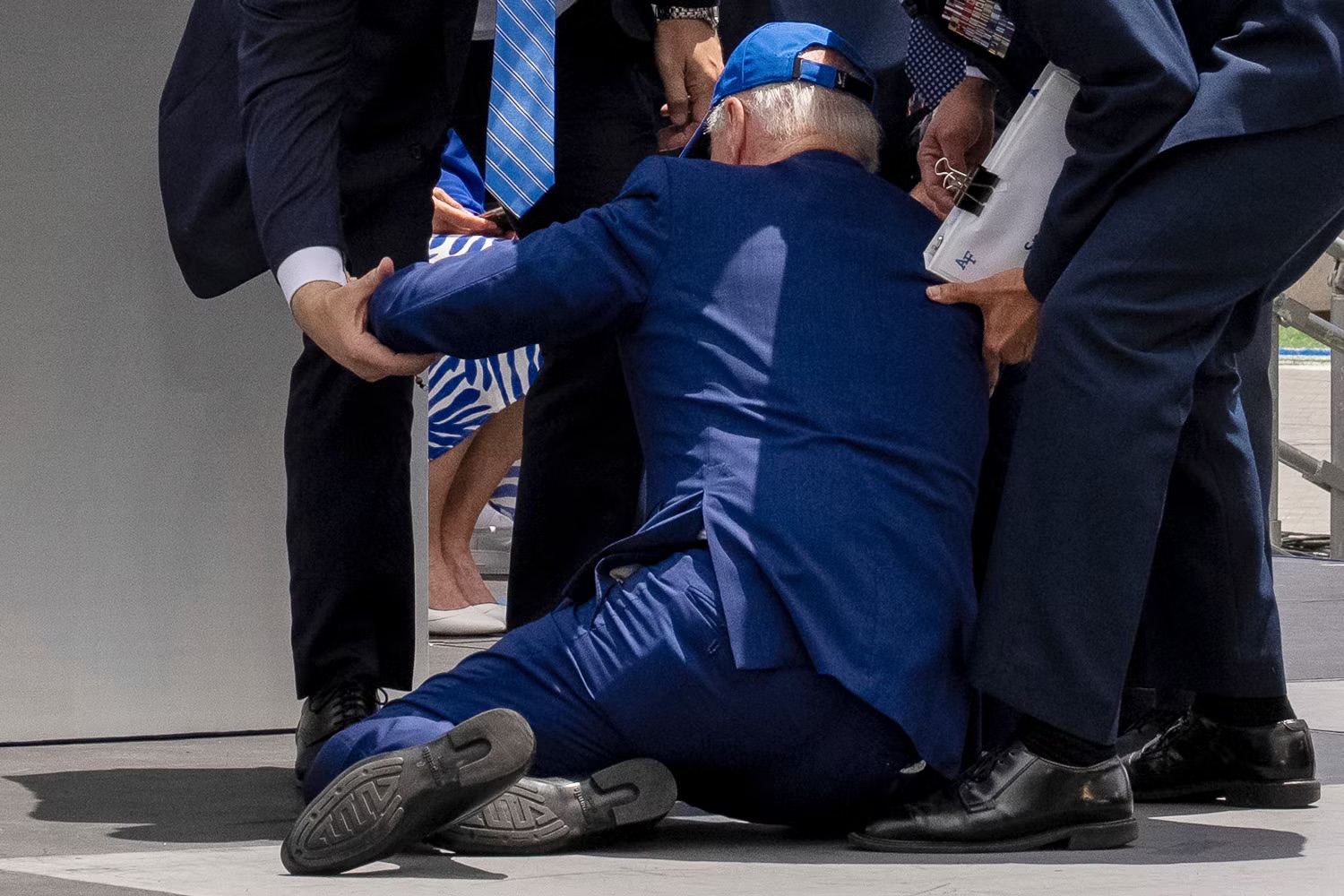 Biden falls falls at Air Force Academy graduation ceremony.